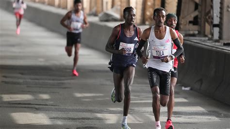 Tola sets NYC Marathon course record to win men’s race; Hellen Obiri of Kenya takes women’s title
